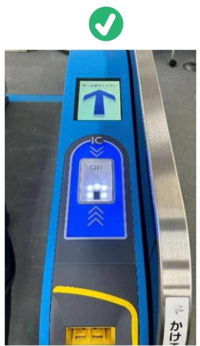 A gate with the QR reader lit in blue.