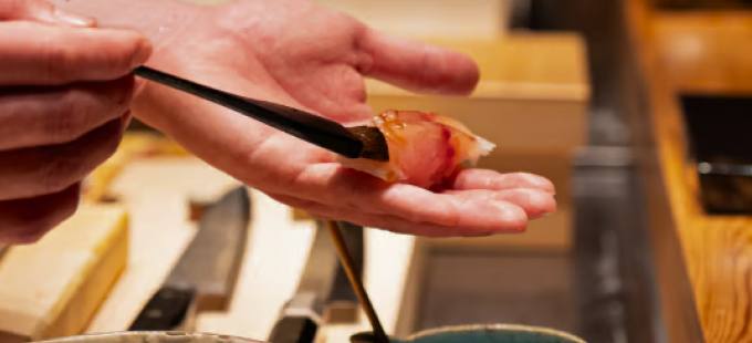 Sushi shaped by hand at the counter
