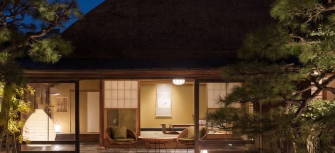 Thatched-roof residence at night